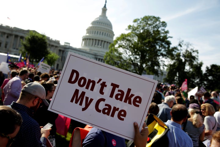 Health care activists with Planned Parenthood and the Center for American Progress protest in opposition to the Senate Republican health care bill on Capitol Hill on June 28, 2017.