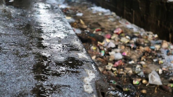 Rubbish and waste accumulate outside the warehouses that were not connected to running water, sanitation, power or heating.