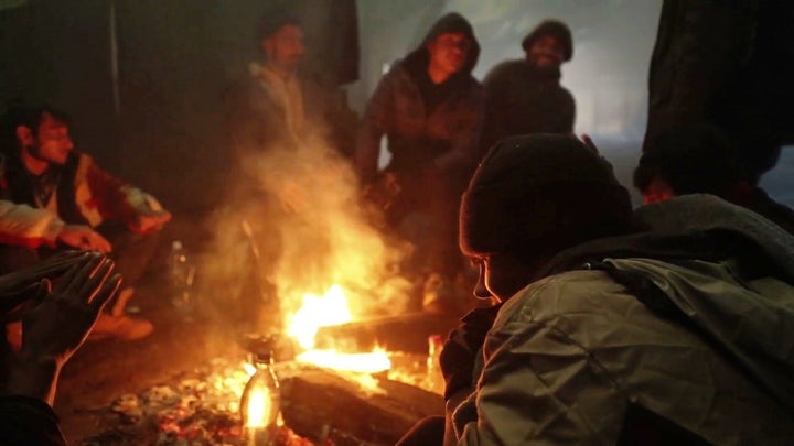 The asylum seekers, mostly Afghan men and boys, kept themselves warm by burning wood and sometimes discarded tires.