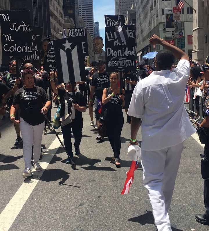 Council Member Williams salutes marchers during the recent NYC Puerto Rican Heritage Parade.