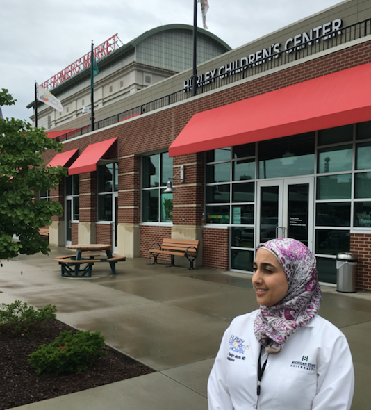 Dr. Zain Alamarat, in front of the Hurley Children's Center and the farmer's market next door.