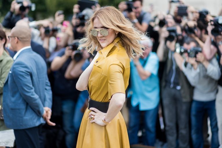 The super star strikes a pose while wearing Dior.