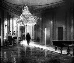 Anton (Ivan Zamychkovskyi) walks through his employer's abandoned mansion in a scene from 1927's <em><strong>Dva Dni (Two Day