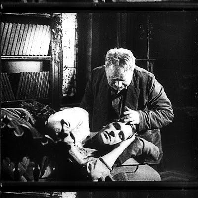 Anton (Ivan Zamychkovskyi) looks down on his estranged son turned Bolshevik soldier (Sergey Minin) in a scene from <strong><e