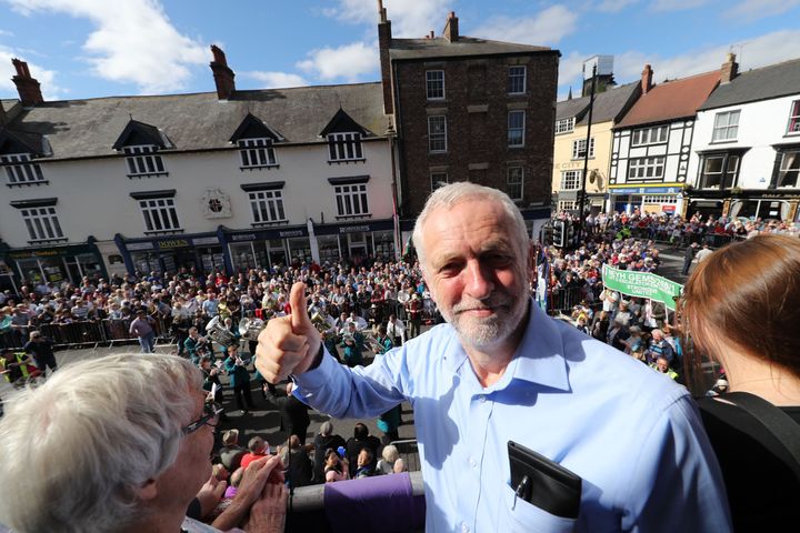 Labour leader Jeremy Corbyn watches the parade from the balcony of the Royal County Hotel during the Durham Miners' Gala in Durham.
