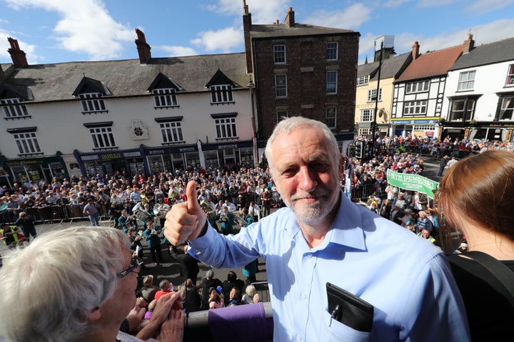 Labour leader Jeremy Corbyn watches the parade from the balcony of the Royal County Hotel during the Durham Miners' Gala in Durham.