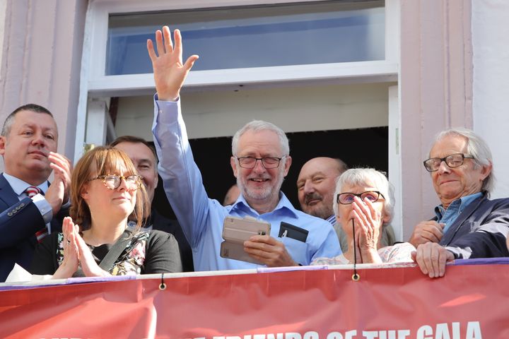 Labour leader Jeremy Corbyn (centre) and film director Ken Loach (right) watch the parade during the Durham Miners' Gala in Durham