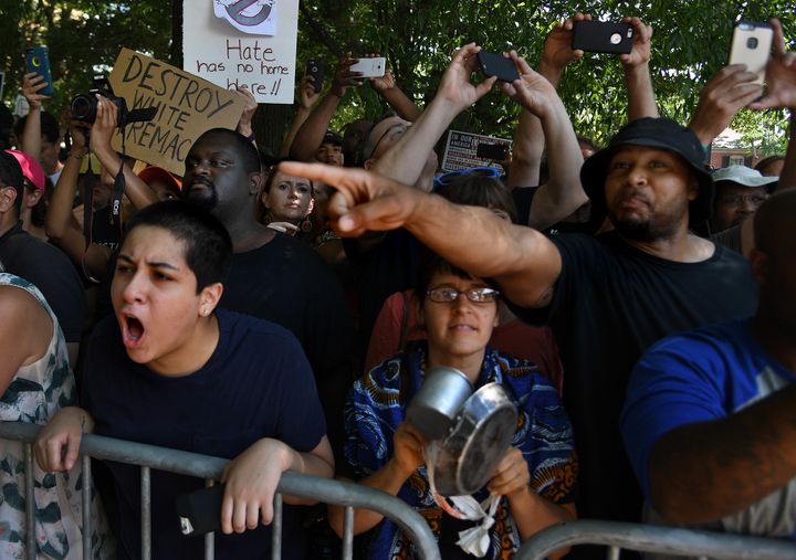  As they watched the KKK rally, anti-KKK rally goers chanted, 'Shame on you, shame on you.