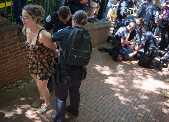 Anti- KKK protesters are arrested.