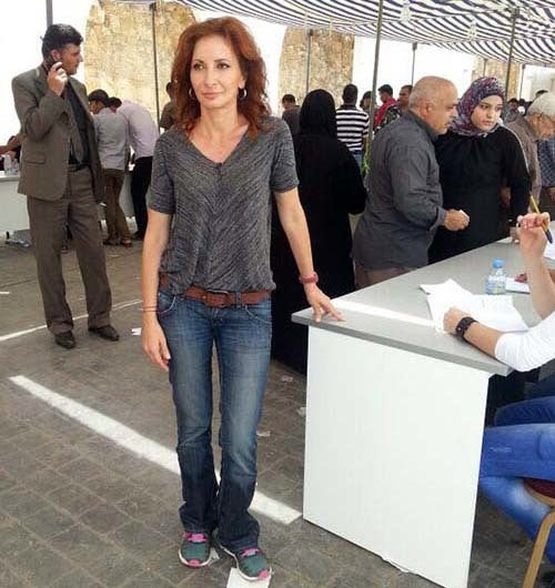 <em>Rula Amin with refugees in Lebanon (courtesy Amin)</em>