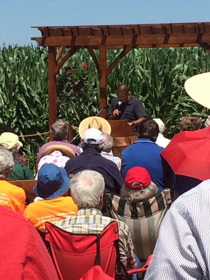 <p>Mark Clatterbuck of Lancaster Against Pipelines addresses the congregants at an outdoor chapel constructed on the proposed route of the Atlantic Sunrise pipeline.</p>