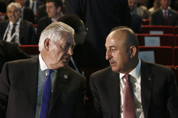 Tillerson speaks with Mevlut Cavusoglu, Turkey's foreign affairs minister, during the 22nd World Petroleum Congress in Istanb