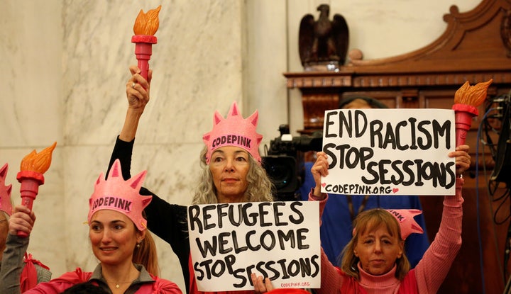 Desiree Fairooz, center, is scheduled be sentenced this week after being convicted in connection with her arrest for laughing during a Senate confirmation hearing.