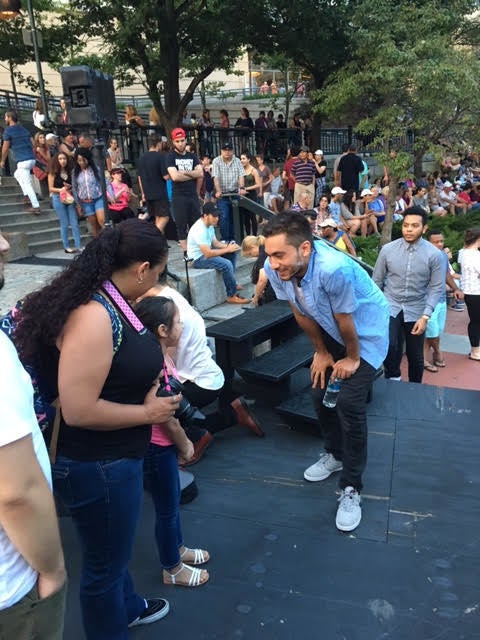 <p>Orlando Hernandez, who plays Romeo in Trinity Rep’s production of <em>Romeo and Juliet</em> for “Shakespeare en el Verano” meets fellow audience members.</p>