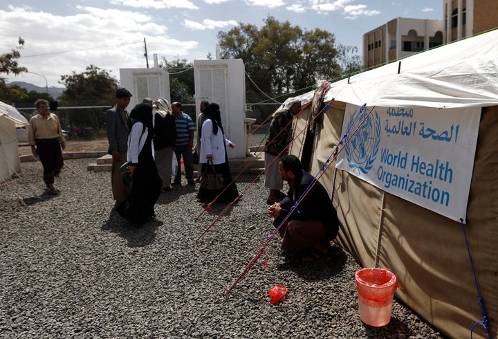 Yemenis wait outside a tent where cholera patients are receiving treatment at Sabaeen Hospital in Sanaa, Yemen, on June 13, 2017. 