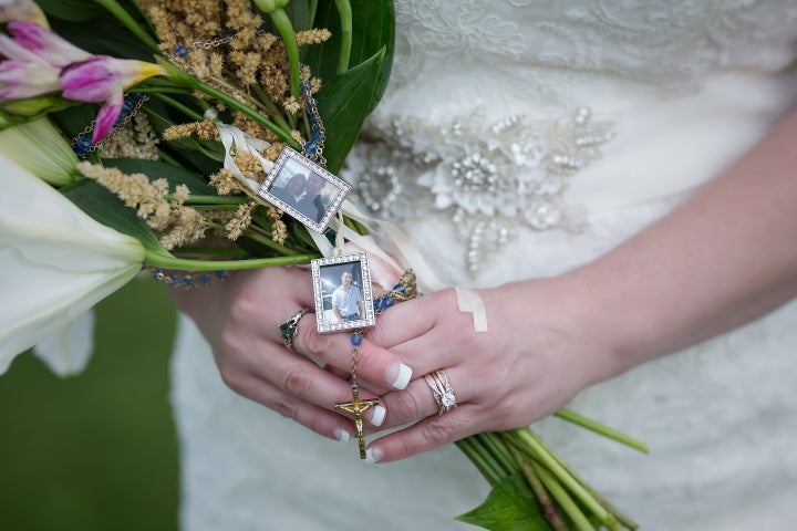 The bride attached a picture of her late son to her bouquet.