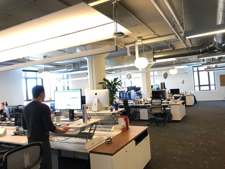 Just a small glimpse into the expansive open floor plan at the new office, capable of accommodating a staff of 600 dedicated team members. I love the standing desks on every table - employee treatment taken to the next level.