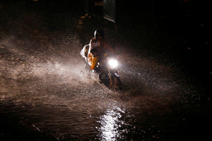  A waterlogged street in Delhi. How can a city with so much rain face water shortages? 