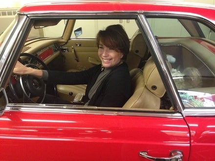 sitting in a cute little priceless mercedes