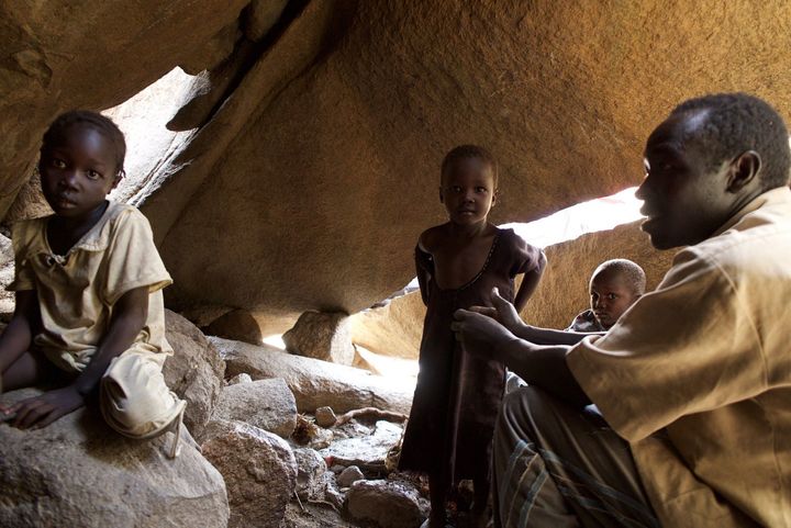 <p>A family shelters in a cave in the Nuba Mountains, to avoid bombings by the Sudan government.</p>