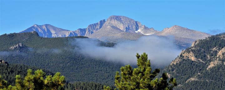 Longs Peak rises above the clouds near Estes Park, Colorado