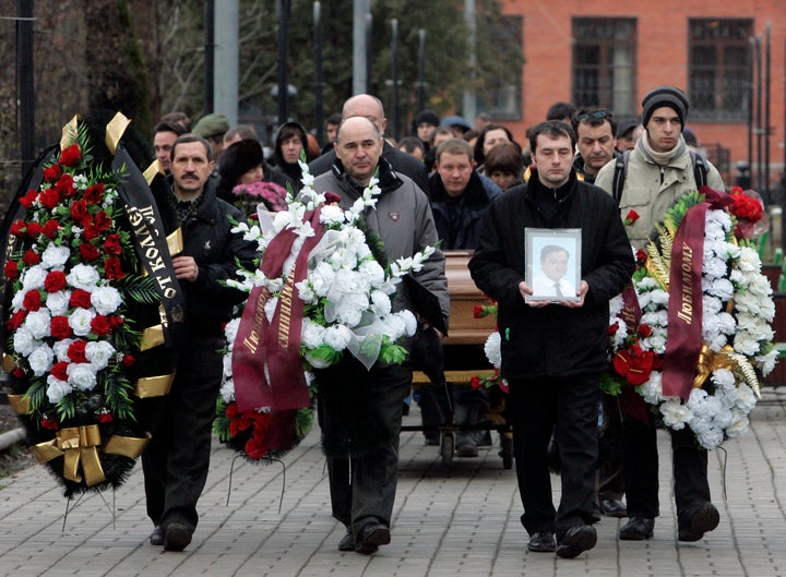 Friends and relatives take part in the funeral ceremony for Sergei Magnitsky in Moscow on Nov. 20, 2009. Magnitsky died in jail after being accused of tax evasion.