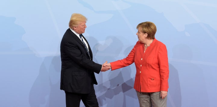 U.S. President Donald Trump is welcomed by German Chancellor Angela Merkel on the first day of the G-20 summit.