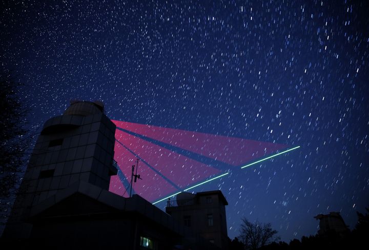 Composite photo shows a satellite-to-earth link established between quantum satellite 'Micius' and the quantum communication ground station in Xinglong, north China's Hebei Province.