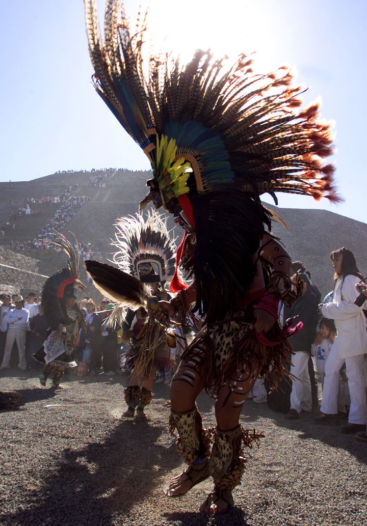 A traditional Mexican dancer performs in front of the pyramid in 2001. Hundreds of people meet in Teotihuacan every year to welcome Spring and to get positive energy from the sun and the moon