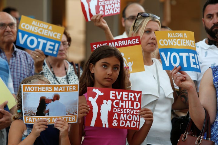 People protested against same-sex marriage outside Parliament House in Valletta, Malta on July 11, a day before the Maltese parliament legalized gay marriage.