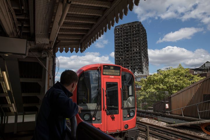  A man looks at Grenfell Tower from a platform at Latimer Road tube station 
