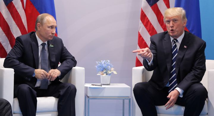 U.S. President Donald Trump, right, said in an interview Wednesday that Russian President Vladimir Putin, left, favored Hillary Clinton in the 2016 U.S. presidential election.