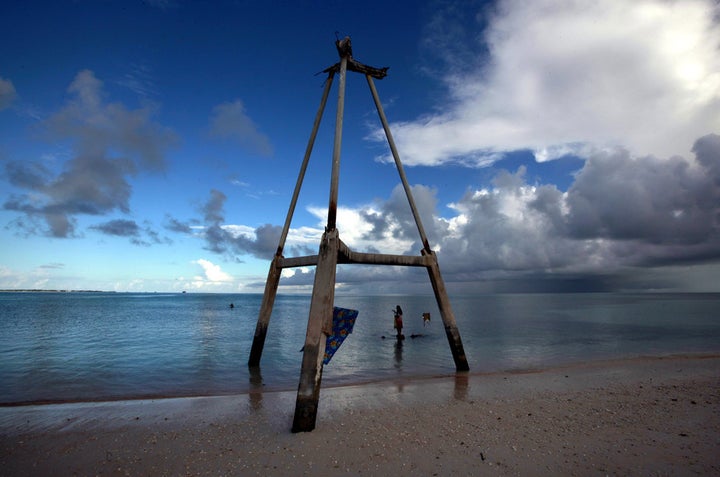 This wood tower on Bikeman islet, in the central Pacific island nation of Kiribati, used to be on the sand. Now it’s in the w