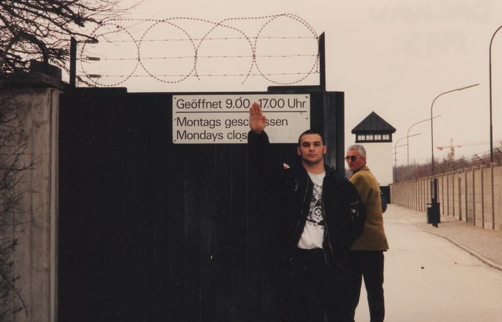 Christian Picciolini at gates of Dachau (Germany, 1992)