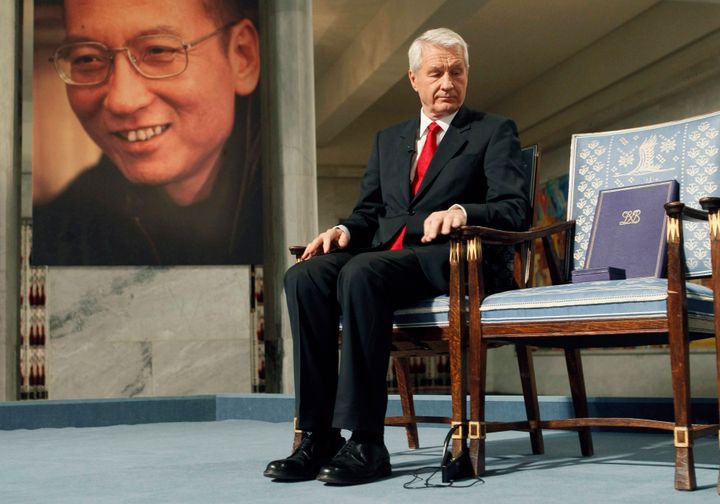 Thorbjoern Jagland, chairman of the Norwegian Nobel Committee, looks down at the Nobel certificate and medal on the empty chair where Nobel Peace Prize winner and political prisoner Liu Xiaobo would have sat during the ceremony at Oslo City Hall on Dec. 10, 2010.