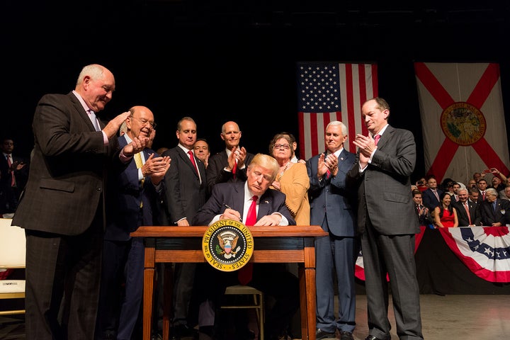 President Donald J. Trump signs the National Security Presidential Memorandum on Strengthening the Policy of the United States Toward Cuba, Miami, June 16, 2017 