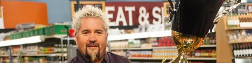 <strong>Guy Fieri's larger than life-sized face is all over this bathing suit, and it must be seen to be believed.</stron