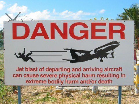A warning sign is seen outside of Princess Juliana International Airport in St. Martin.