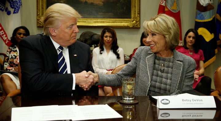 Trump congratulating DeVos on her confirmation during a meeting with teachers and parents at the White House on February 14, 2017.