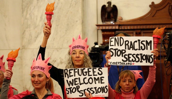 Fairooz, center, at Sessions' confirmation hearing in January, before her arrest.