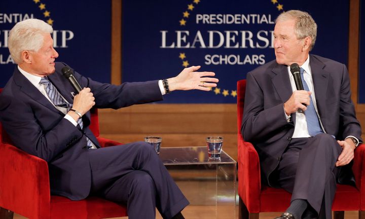 Former Presidents Bill Clinton and George W. Bush participate in a moderated conversation at the George W. Bush Presidential Library in Dallas on Thursday.