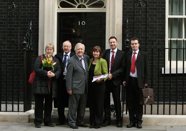 Haemophilia Society members deliver a copy of the Archer report to Downing Street.