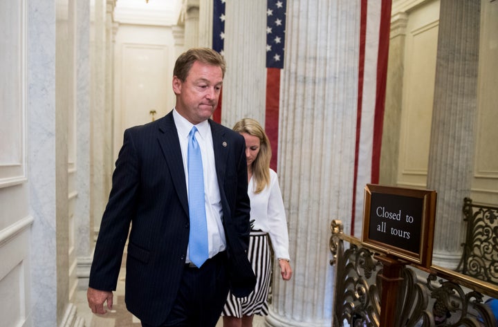 Sen. Dean Heller (R-Nev.) leaves a meeting of Republicans on the endangered health care legislation on Thursday, July 13, 201