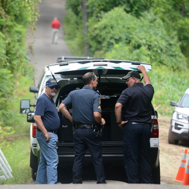 Police search for the missing men on July 13, 2017. 