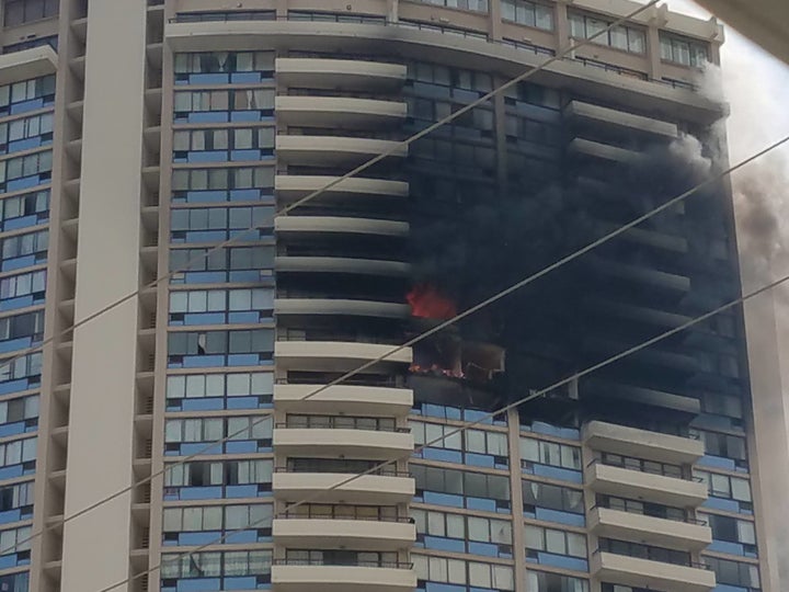 Joel Horiguchi, a resident of Marco Polo, took this photo of the building on fire about 4:50 p.m. local time.