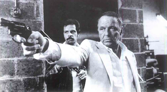 <p><strong><em>Sinatra taking charge on the set of Contract on Cherry Street</em></strong></p>