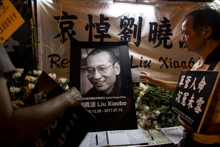 Mourners remember Liu Xiaobo in Hong Kong on Friday. Liu, who was awarded the Nobel Peace Prize in 2010 while imprisoned, died of cancer while under guard in a hospital in Shenyang last week.