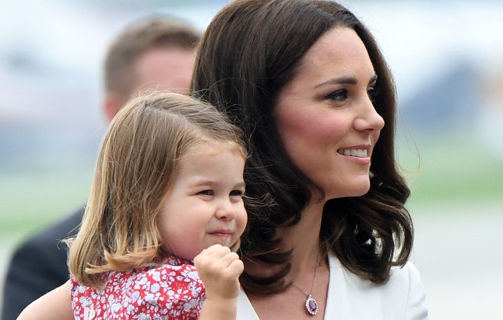 Duchess of Cambridge carries Princess Charlotte of Cambridge as they arrive with Prince William, Duke of Cambridge and Prince George of Cambridge on day 1 of their official visit to Poland on 17 July 2017 in Warsaw, Poland.