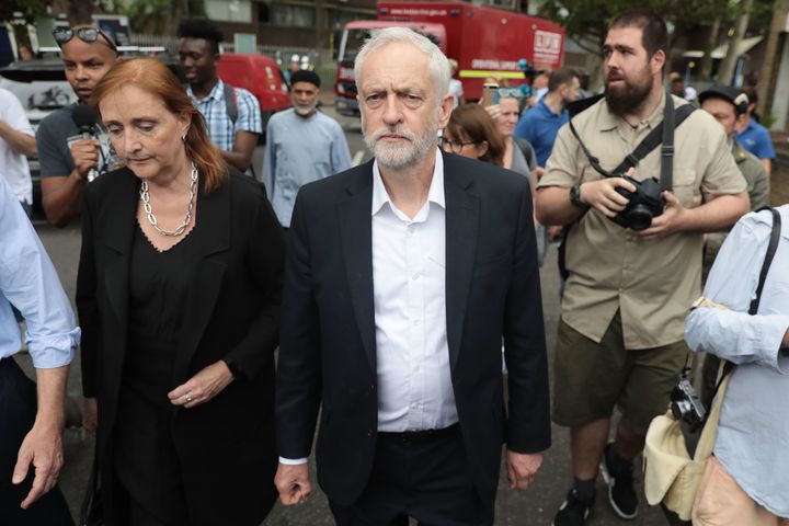 Labour leader Jeremy Corbyn visits the scene of the Grenfell Tower fire with MP for Kensington, Emma Dent Coad 