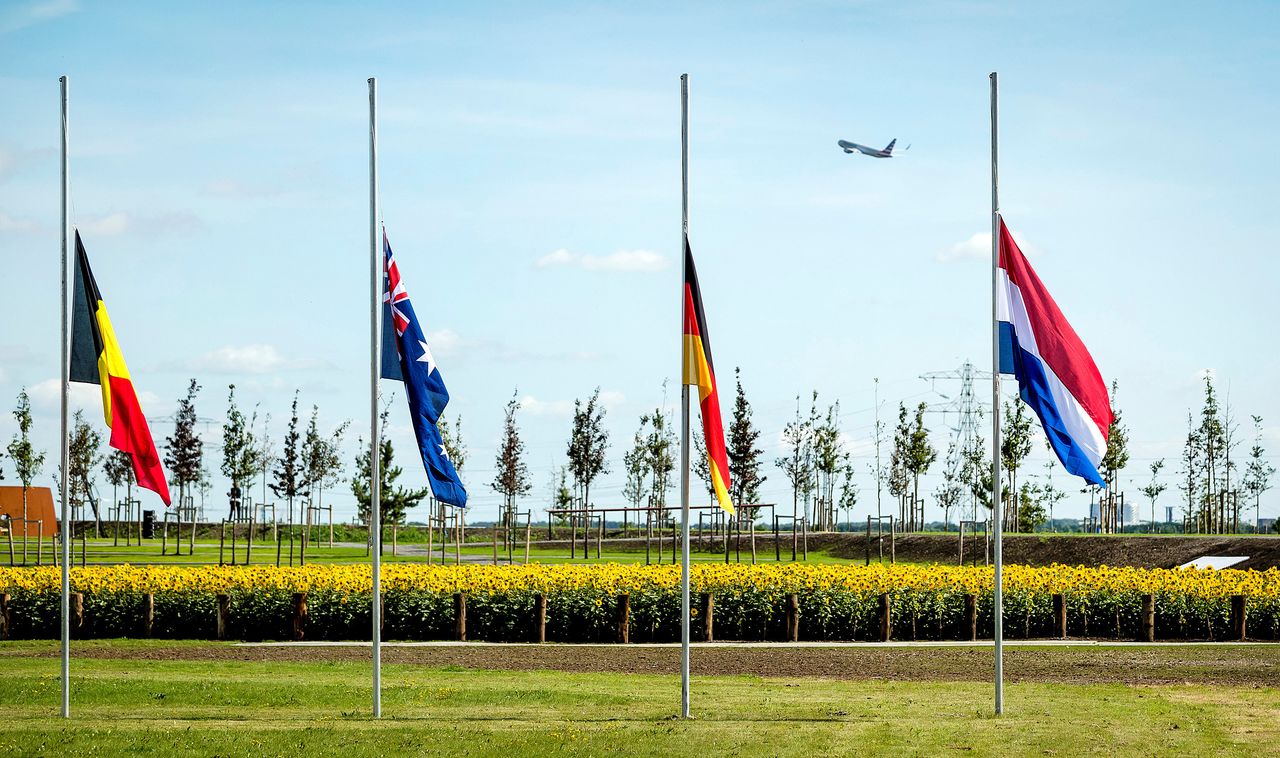 Flags are seen at half mast during an event to unveil a national monument to commemorate the victims of the Malaysia Airlines MH17 crash in Vijfhuizen, Netherlands, on Monday.